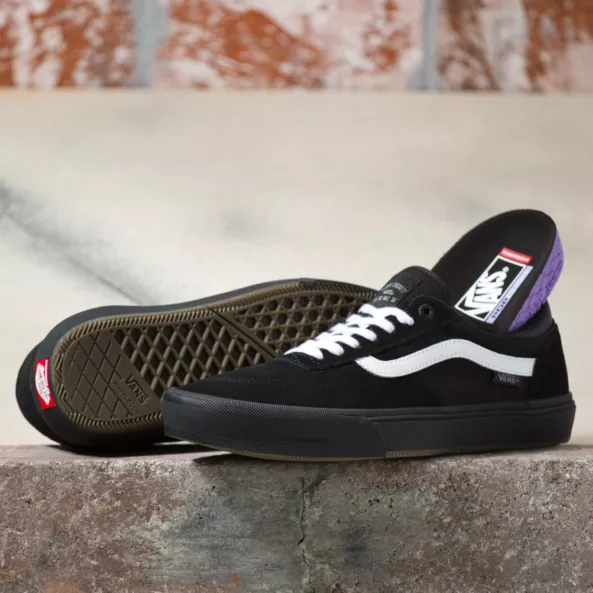 All black vans white stripe hotsell